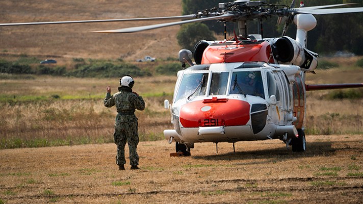 navy search and rescue helicopter lands at unity of effort